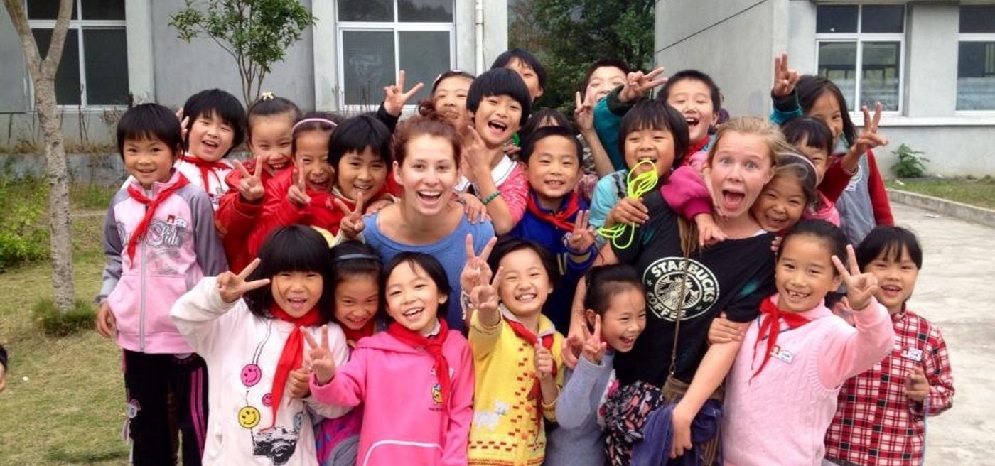 AV volunteers in China with smiling pupils