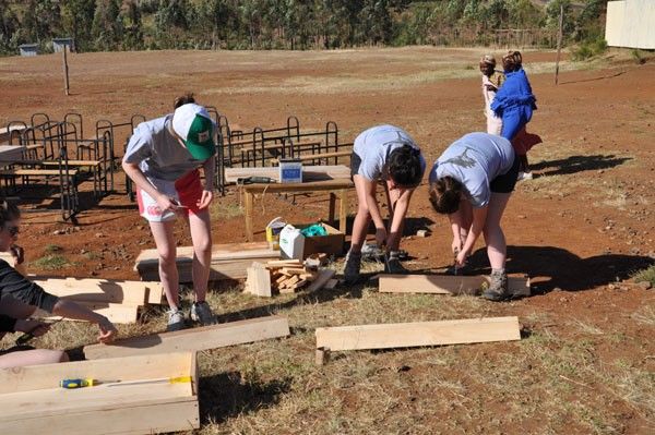 Oakham students on their School Trips to Africa assembling desks