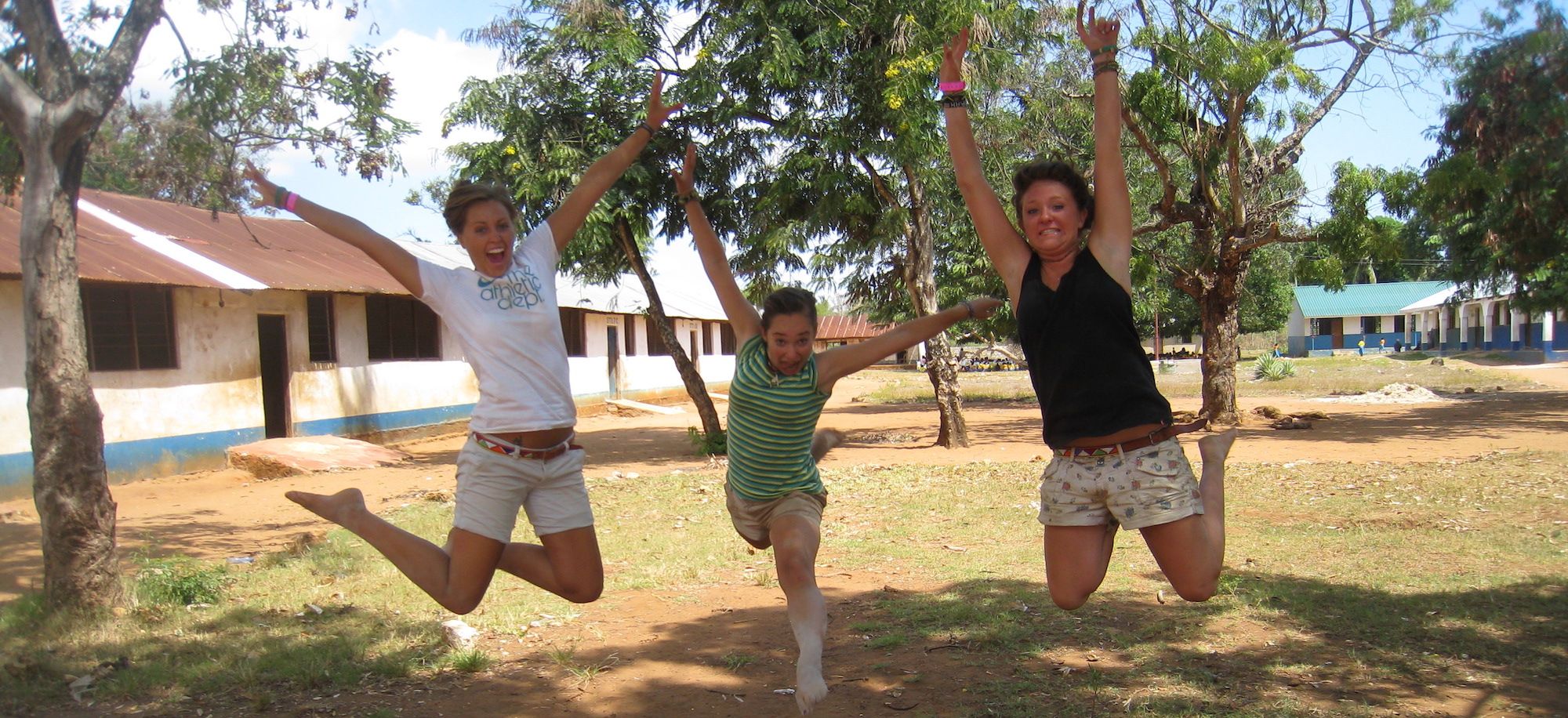 Gap Year Volunteers Jumping in Kenya village