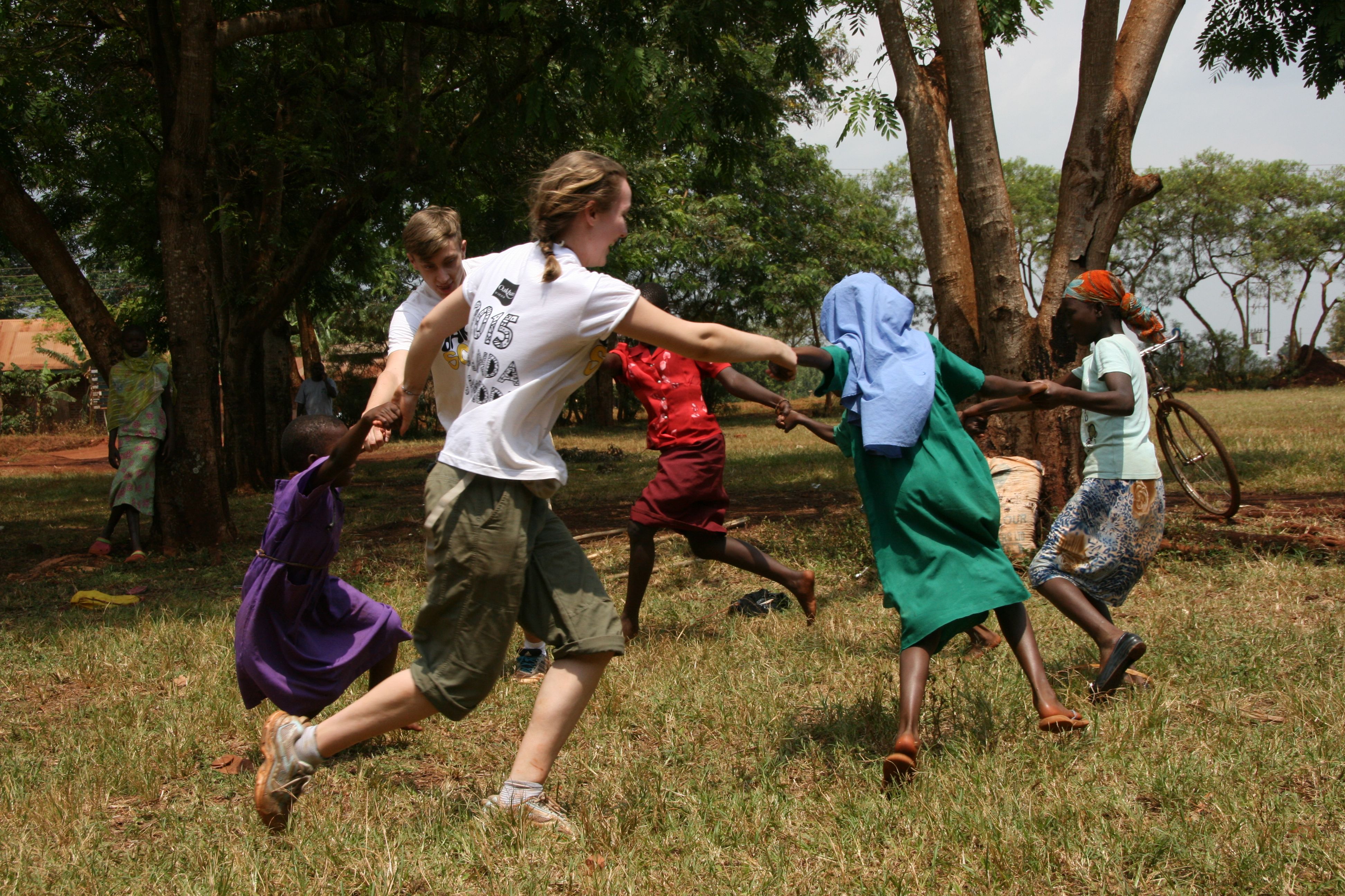 Oakham students dancing with the children on their School Trips to Africa