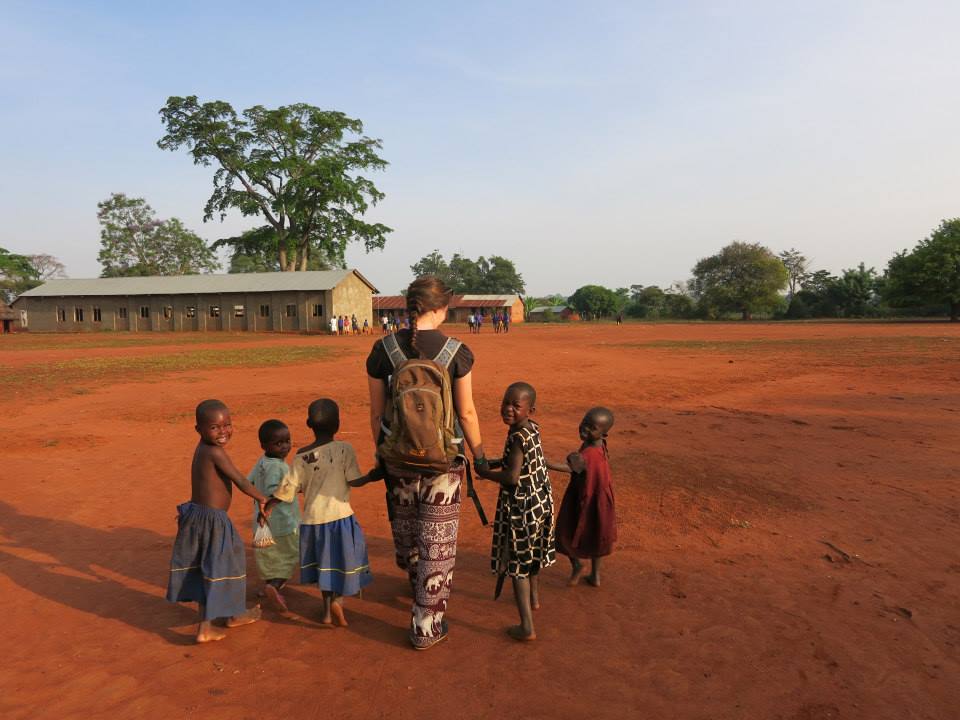 Unexpected exam results could help you make a difference, walking to school with children in Uganda on a Gap Year