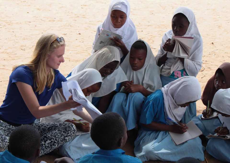 volunteer teaching children in Africa