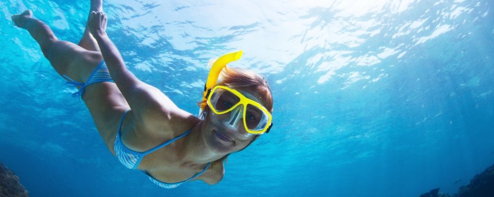 A woman snorkeling in the ocean