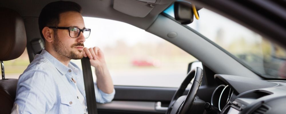 A man on the pilot seat of a car