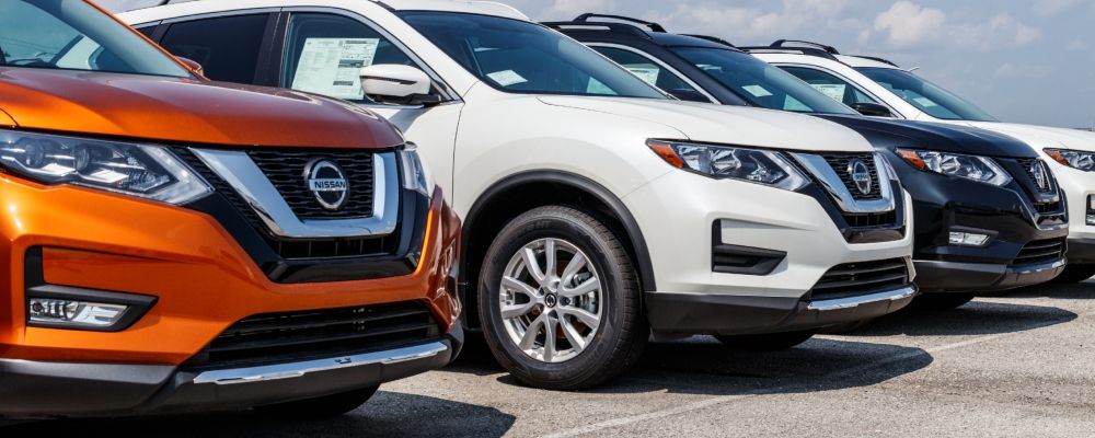 three different SUV parked