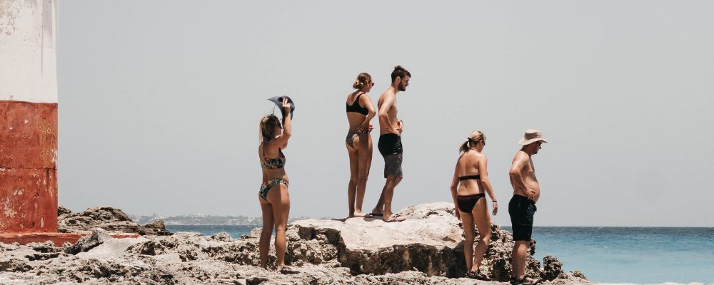 people at cancun lighthouse