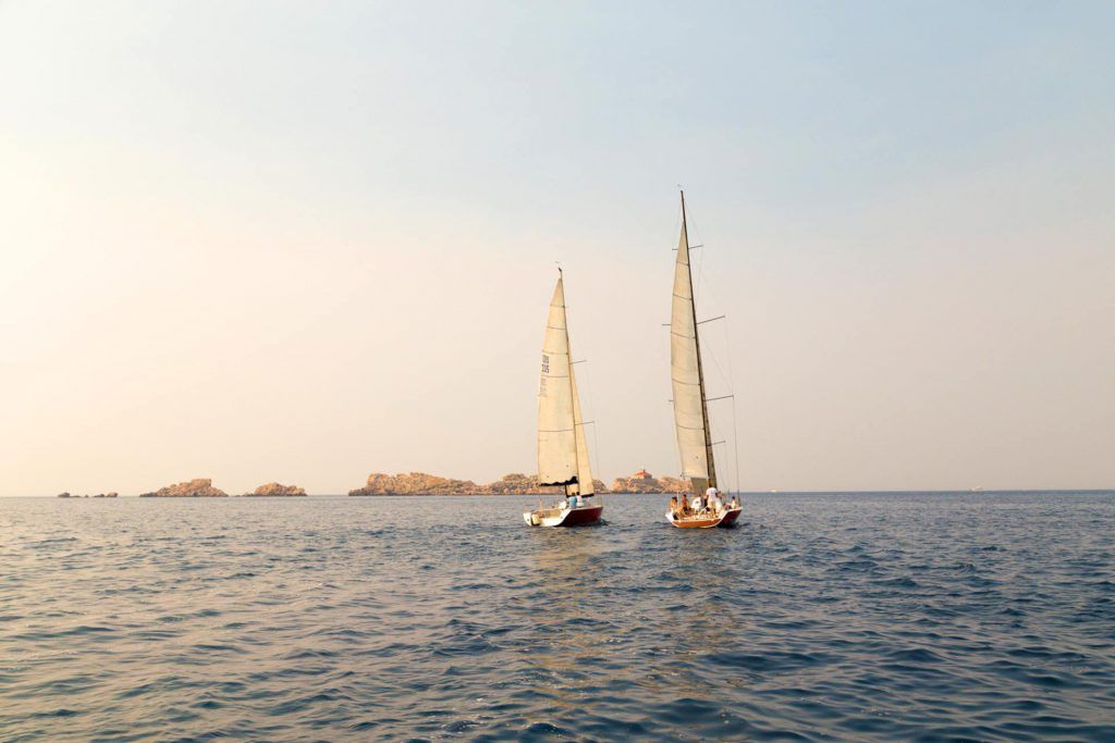 two red sailboats in Romantic sunset sailing around Dubrovnik tour