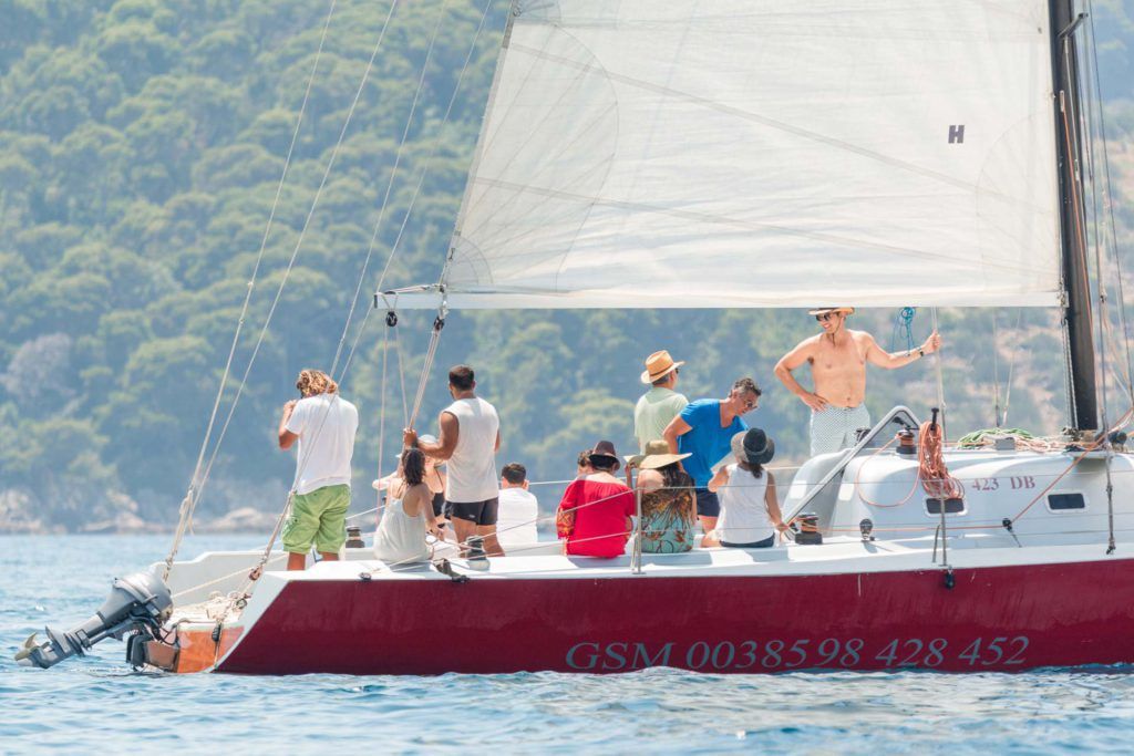 People with skipper aboard sailboat having great time on Full day Dubrovnik Sailing tour