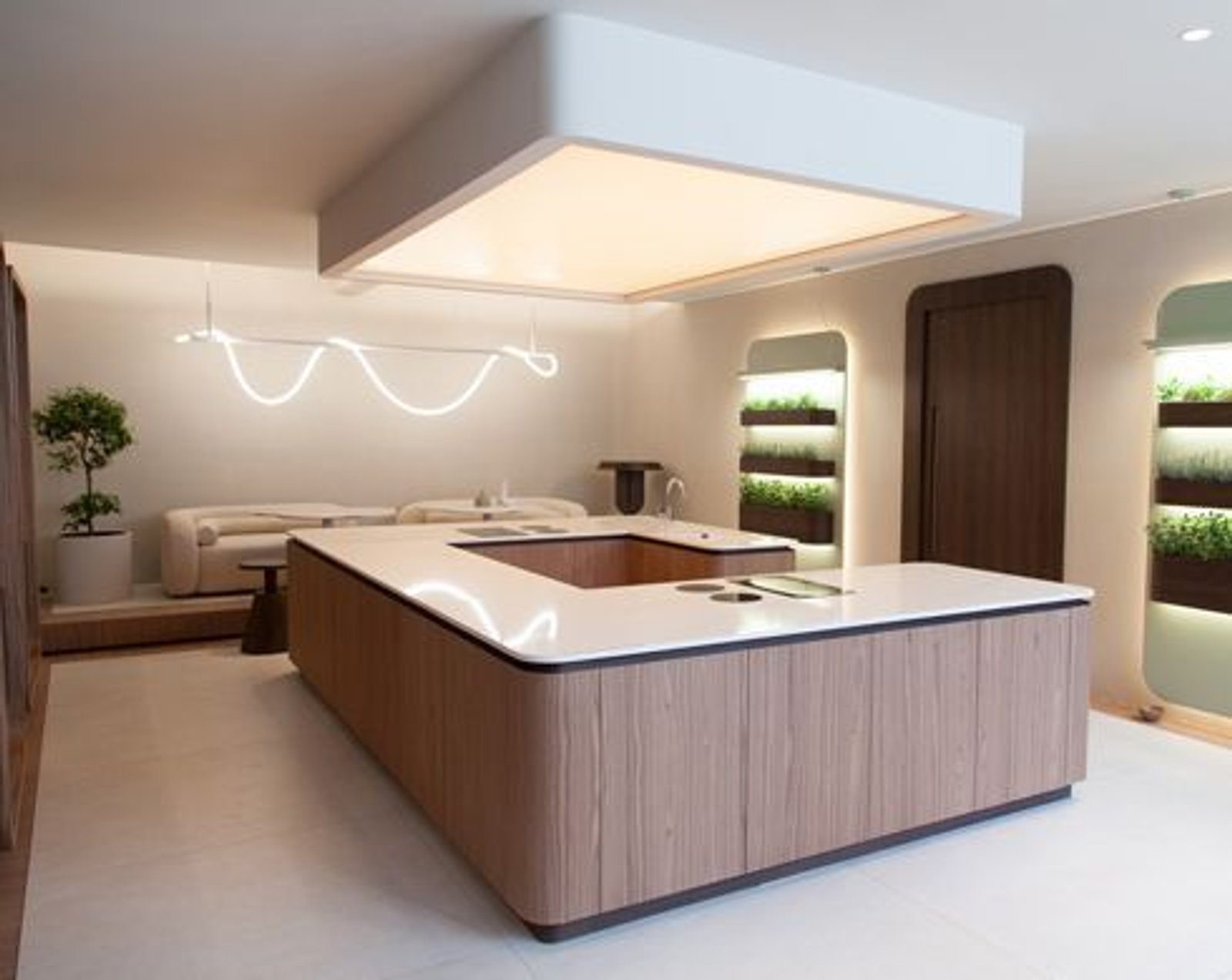 Cocina moderna con isla curva de madera y detalles de iluminación integrados — proyecto Casa Foa Retiro 2022, por Vite Porcellanato, en Buenos Aires