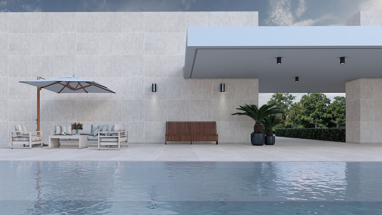 Relajada área de piscina moderna con fachada de piedra y muebles de exterior — proyecto Piedra, por TENDENZA, en Buenos Aires