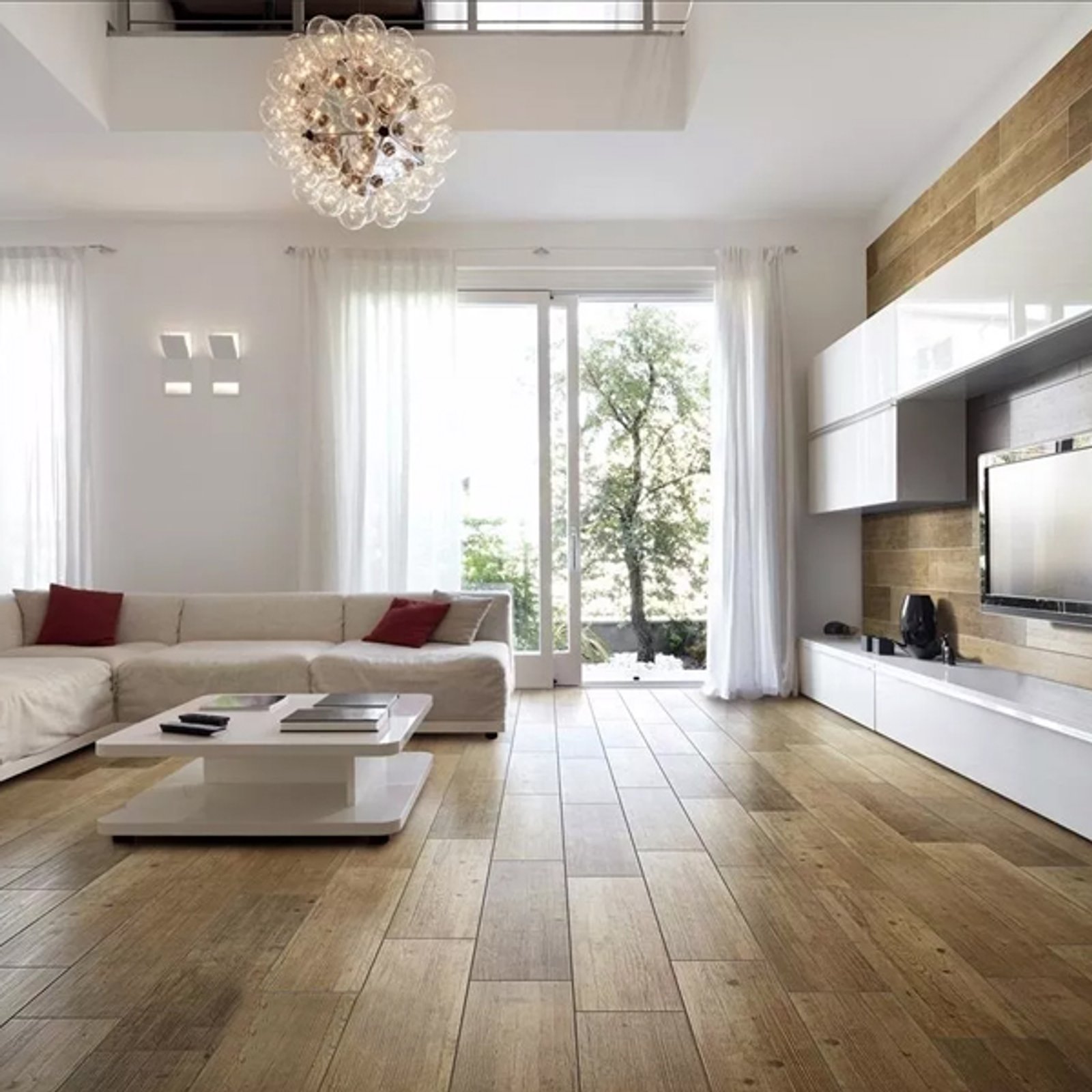 Sala de estar moderna com luz natural e sofá modular branco — projeto Porcelanatos, por The Flooring Company