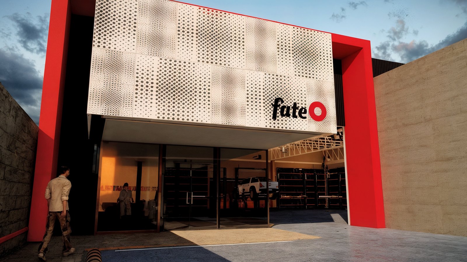 fachada comercial moderna con paneles perforados y detalles rojos — proyecto NAVE COMERCIAL, por ML ARQUITECTURA / ARQ. MARIANO LEOTTA, en San Juan