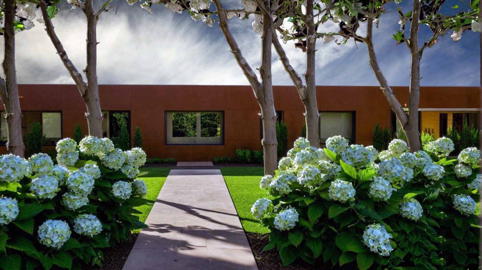 Jardín moderno con fachada colorada y camino de piedra — proyecto Jardín de campo para oficinas comerciales, por LM arquitecta+paisajista, en Villa Valeria