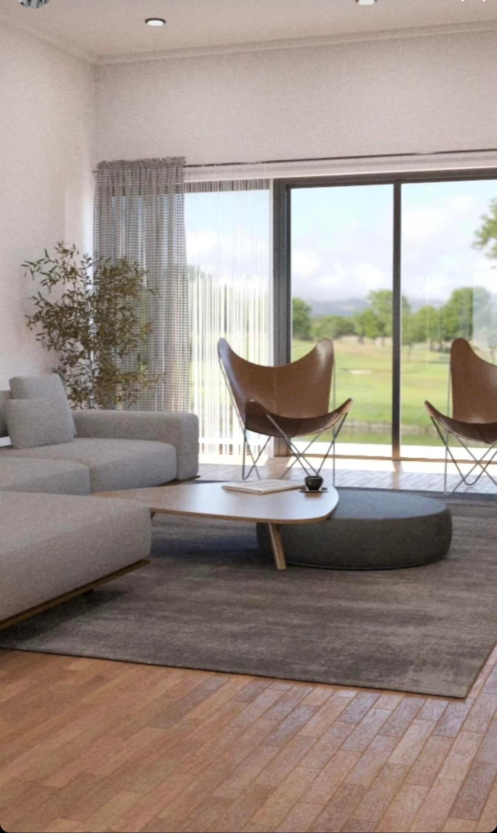 Sala moderna com poltronas borboleta e vista rural — projeto Casa en Country, Corrientes, por Arquitecto Gustavo Maidana, em San Luis del Palmar