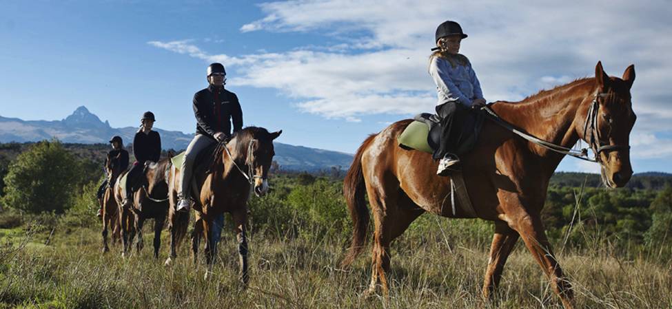Ride beneath snow-capped Mount Kenya
