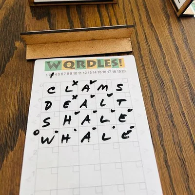 WQRDLES: A Tactile Wordle-Like Multi-Player Word Deduction Game