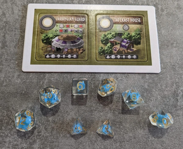 Cover image of Champions of Midgard: Polyhedral Dice Promo Tiles board game