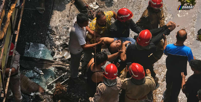 Rescue teams and investigators at the scene following the deadly Delhi hotel fire in Malviya Nagar.