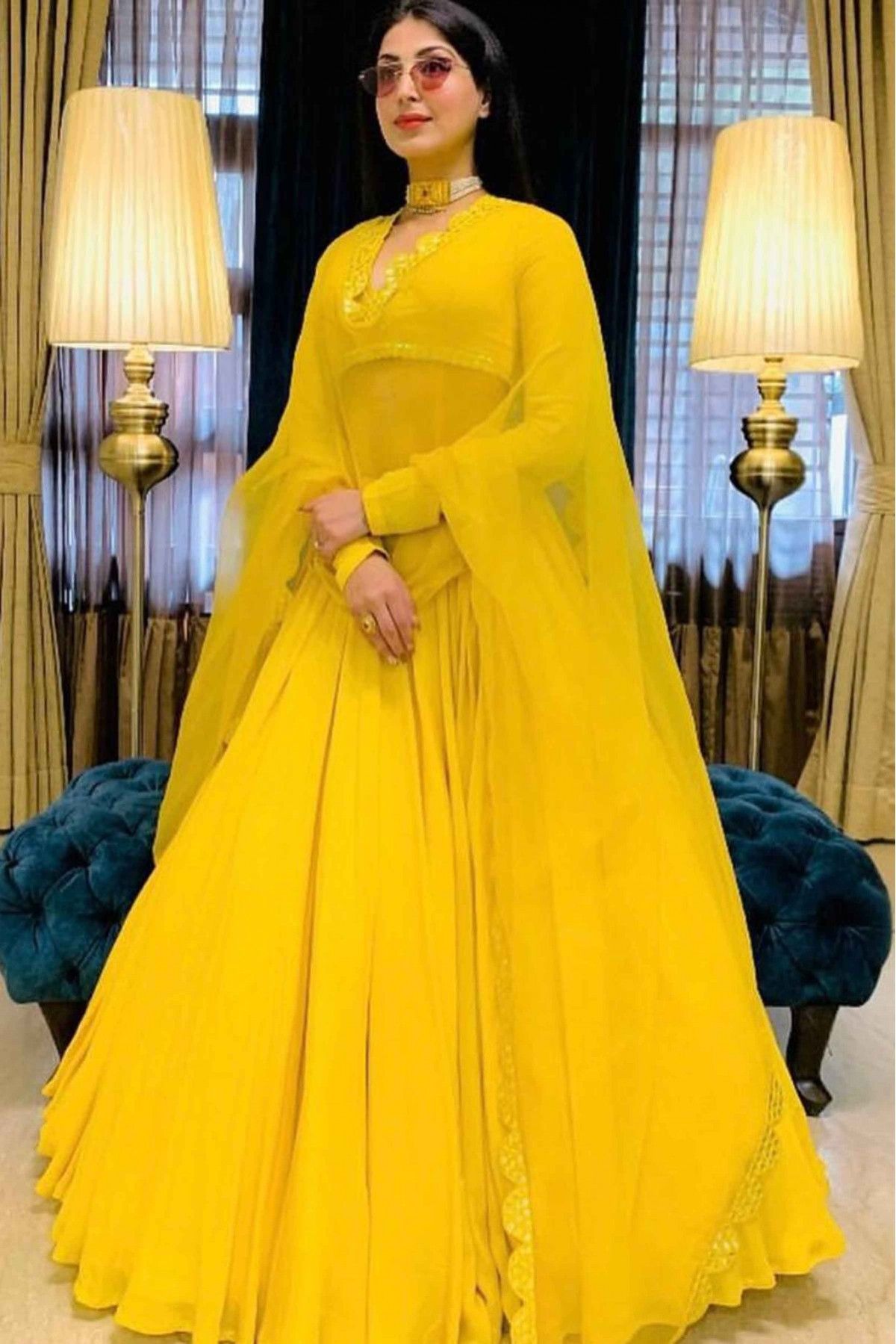 Yellow Elegance Latest Designer Party Wear Heavy Soft Net Lehenga Choli.