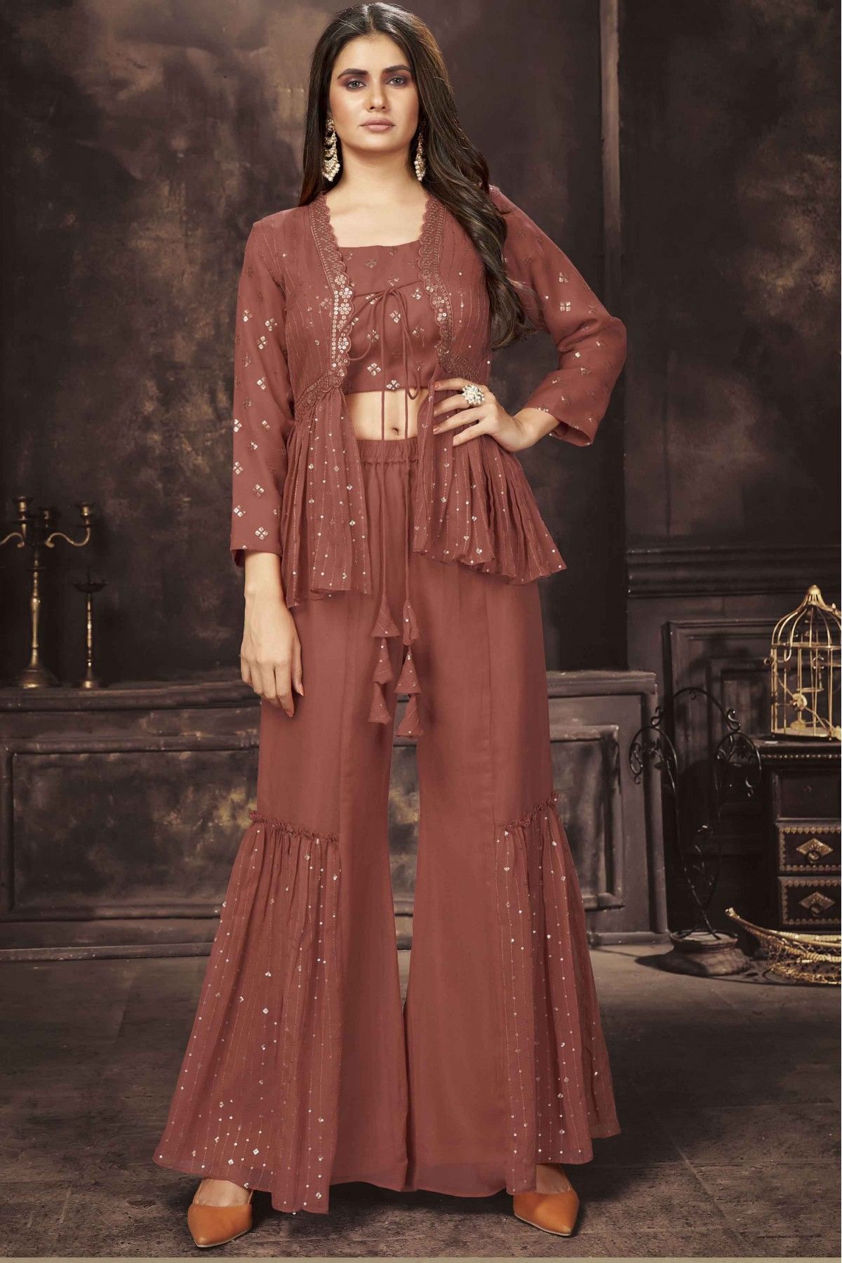 https://ik.imagekit.io/bhsa3gea8yj/products/tr:w-1200/2022/May/Georgette-Sequins-Work-Fusion-Wear-In-Rust-Colour-SM5413787-A.jpg