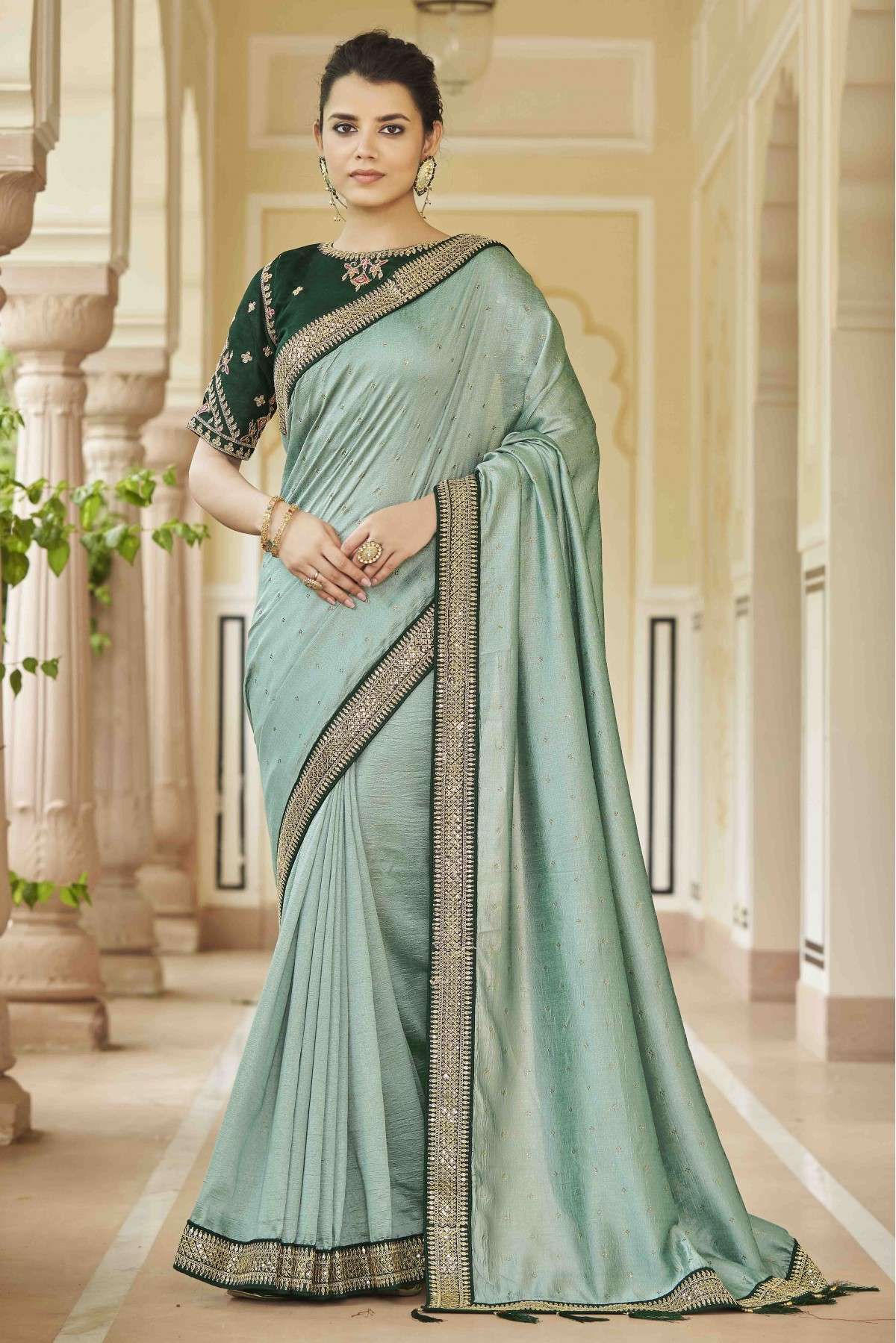 Exotic Pista Green Silk modal Saree with Red Blouse