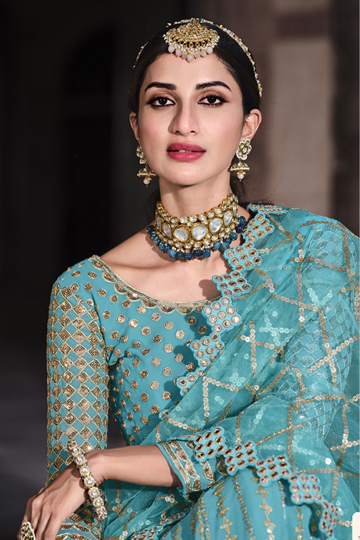 Unzillas - A beautiful turquoise lehenga, choli, and dupatta ensemble with  