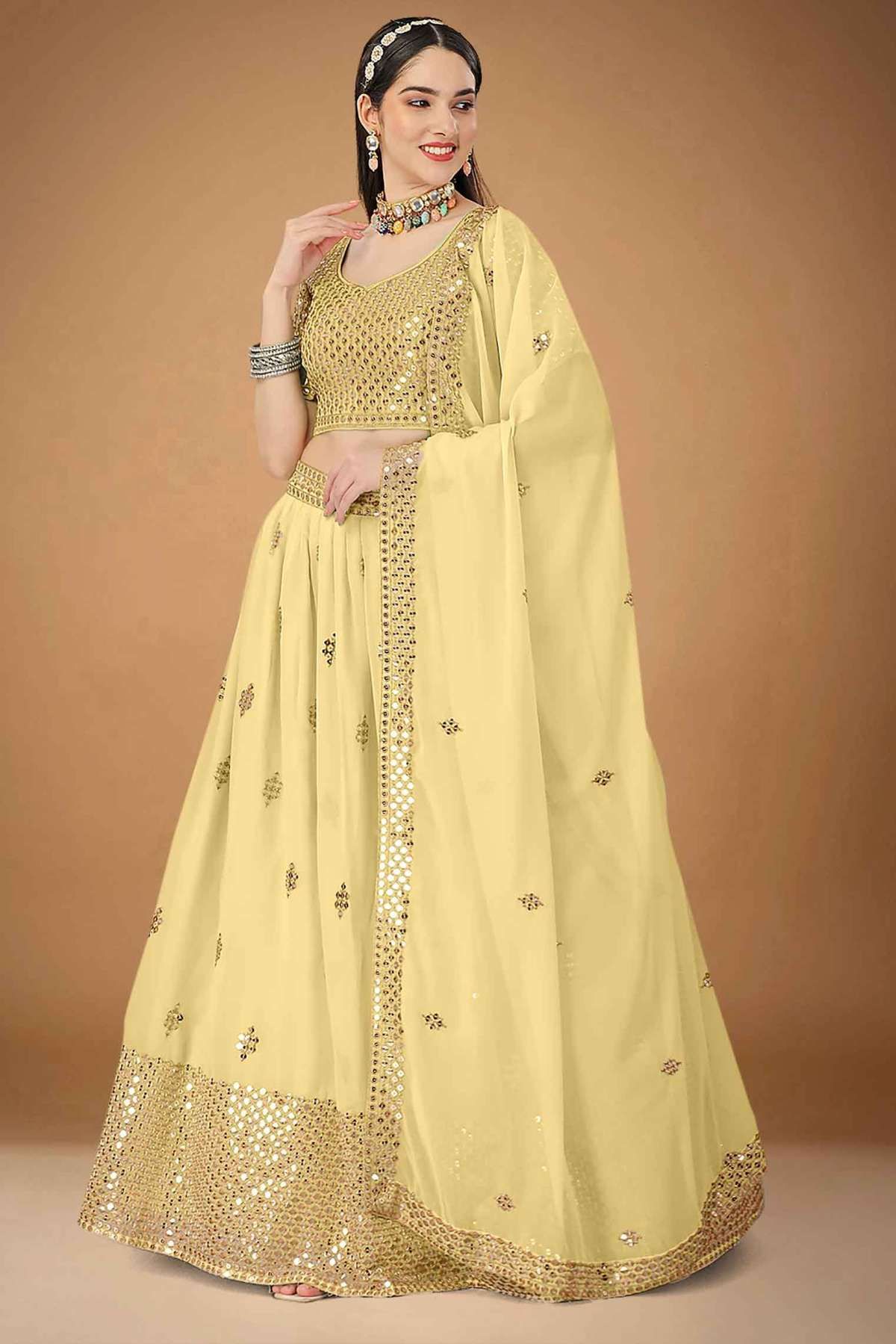 Faux Georgette Embroidery Lehenga Choli In Cream Colour