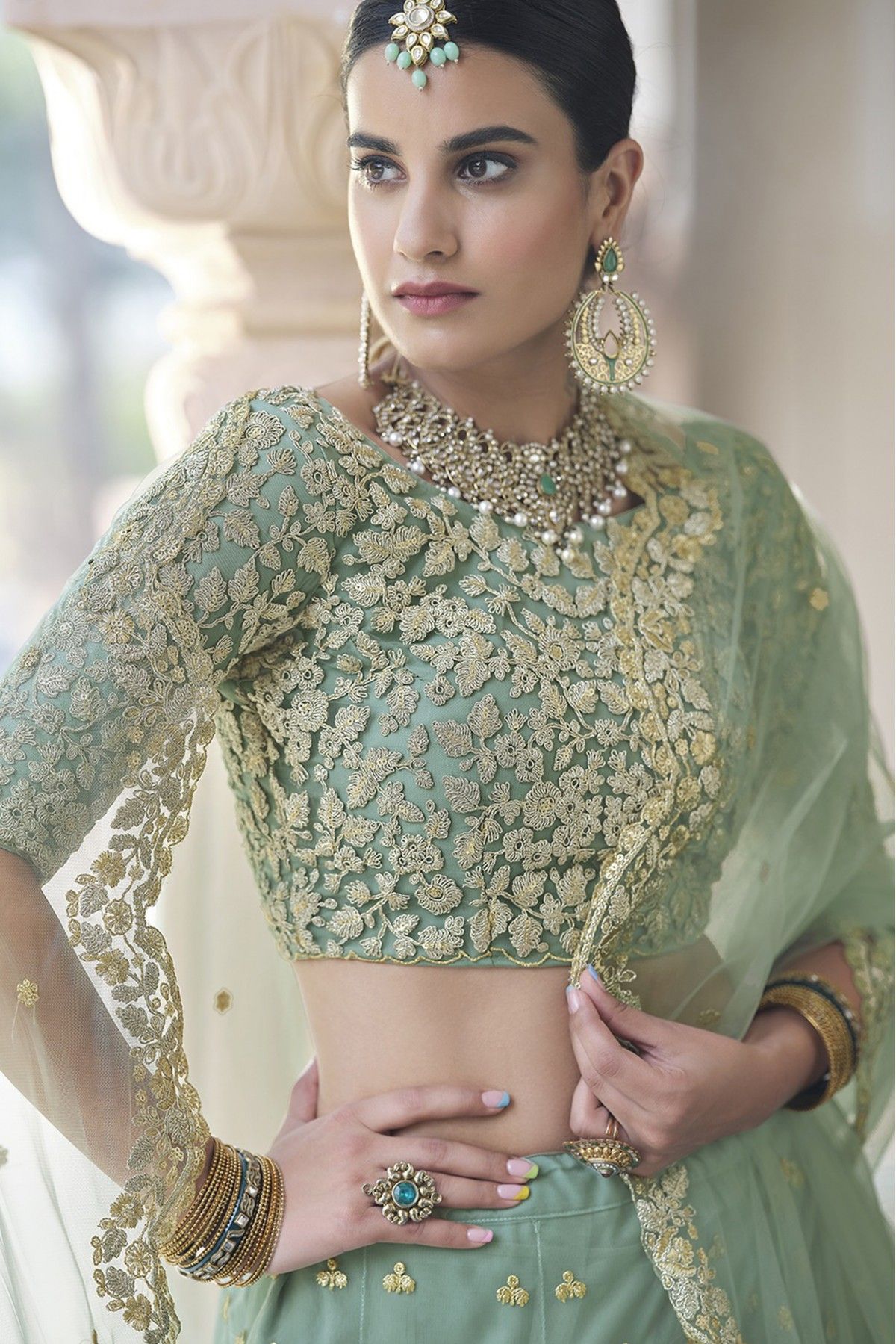 Lehenga Choli : Pista green soft net sequence work bridal