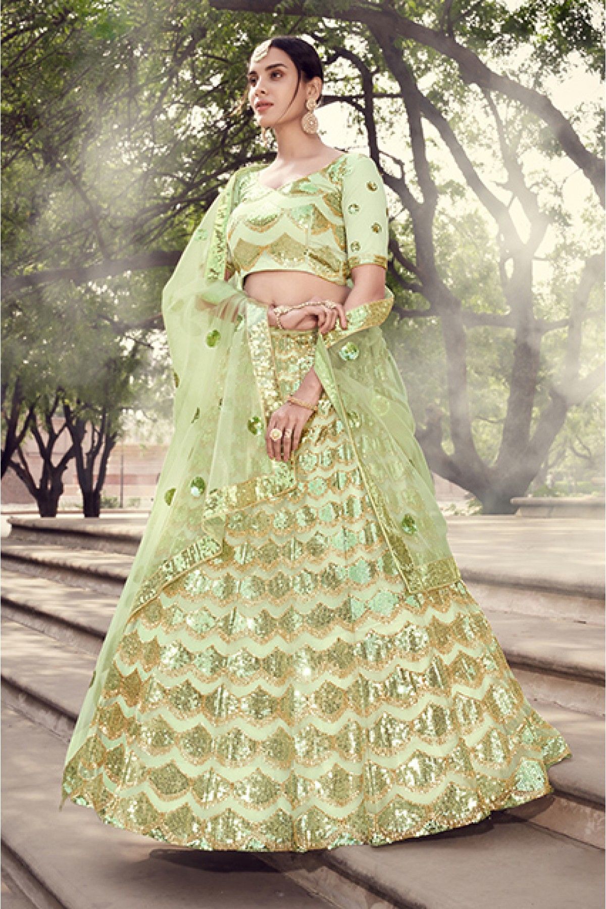 Lehenga Choli : Pista green soft net sequence work bridal