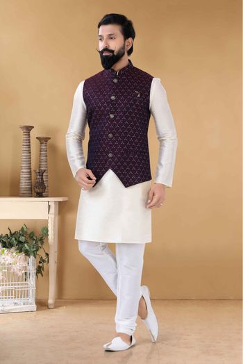 Photo of peach waistcoat with embellishment worn over white kurta