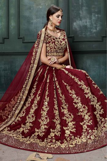 Raw Silk Embroidery Lehenga Choli In Maroon Colour