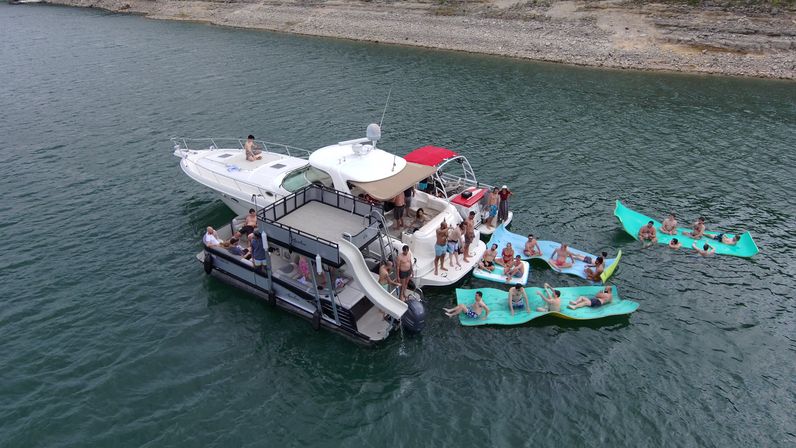 Big Tex Party Boats: Lake Travis - Party Barge, Double Decker, and Tritoon Charters with Captain, Waterslide, YETI and more image 60