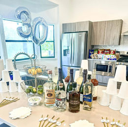 Bachelor-Themed Bar Set Up with Personalized Banner, Party Supplies, Games, Booze & More image 5