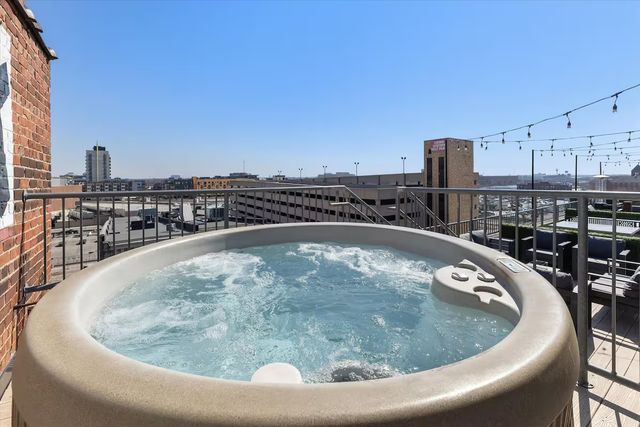 Skyline Penthouse: Hot Tub, Fire Pit + Rooftop Patio in the Heart of Downtown image 4