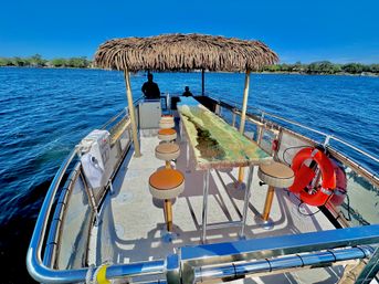 The Pink Dolphin: Private Crab Island Tiki Charter (Up to 18 People) image 12