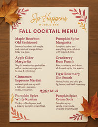 Cozy fall cocktail menu on cream cardstock listing seasonal cocktails and mocktails, decorated with autumn leaf illustrations and real maple leaves on a wooden table.