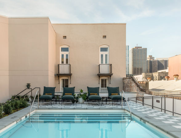 Boutique Suites. Rooftop Views. The Streetcar at Your Door. Hotel Perle. image 4