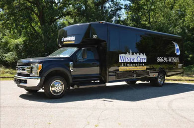 25-Passenger Party Bus with Wrap-Around Seating, Uniformed Chauffeur & Optional Drink Packages image 1