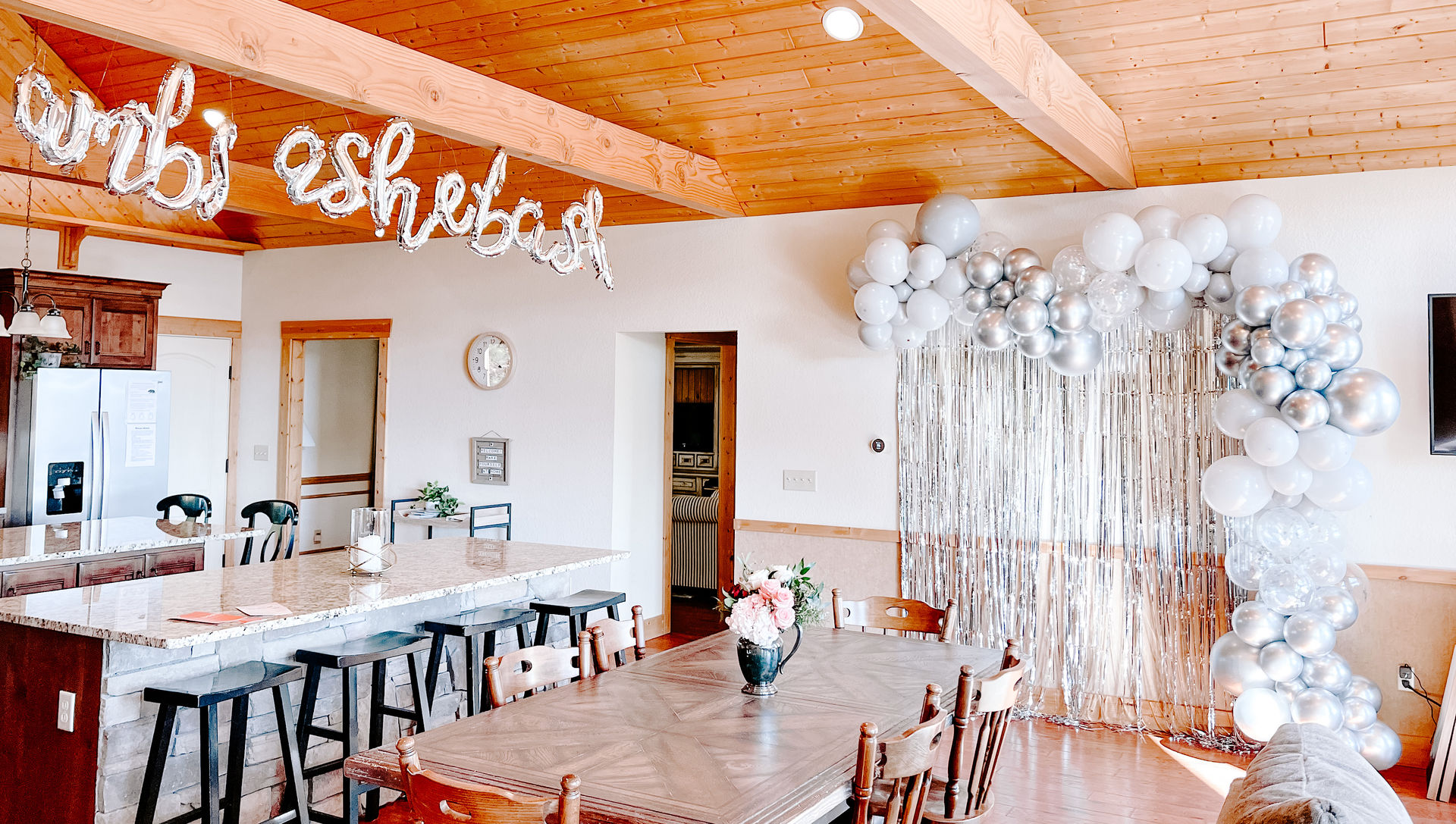 feather boa backdrop and banner - with a champagne / mimosa bar