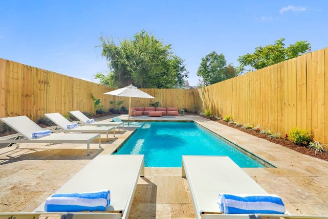 Modern Urban Oasis with 5 Bedrooms, Pool, Patio & Parking  image 2