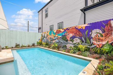 Hip Art-Filled Uptown Oasis with Heated Pool and Parking image 5