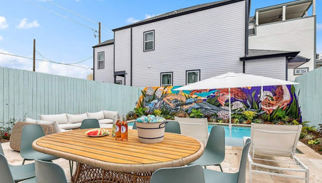 Hip Art-Filled Uptown Oasis with Heated Pool and Parking image 1