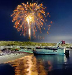 Captained Adventure to Crab Island: Options for Sunset Cruises with Dolphins & Fireworks image 5