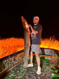 Nighttime Bowfishing: Fishing Meets Archery for the Ultimate Bachelor Experience image 6
