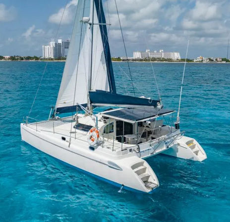 Private Catamaran Tour to Isla Mujeres: Captain, Crew, Snorkeling, Beach Club + Open Bar image 2