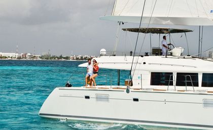 Private Catamaran Tour to Isla Mujeres: Captain, Crew, Snorkeling, Beach Club + Open Bar image