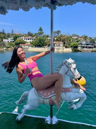 Iconic Pink BYOB Carousel Boat Experience with Upper Terrace, Carousel Horse Prop, and more image 13