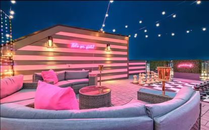Rooftop Royale: 20 Beds + Rooftop Lounge with Large Chess, Fire Pit + Bar image 1