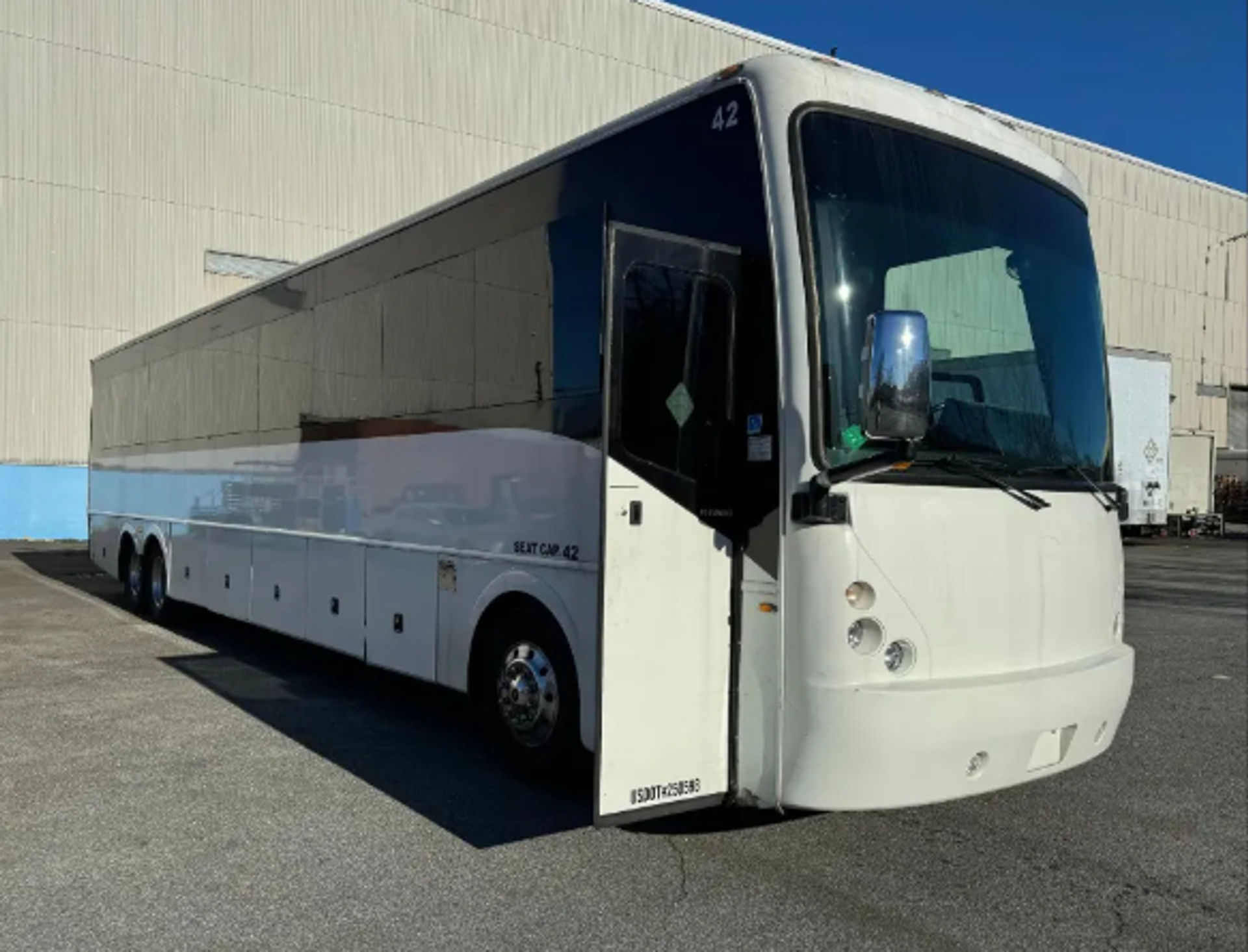 Immense Party Bus for 50 People with Bar, Laser Lights, LCD Screens & More image 1