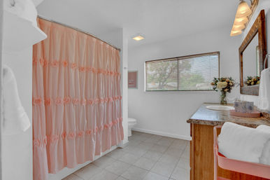 The Pink Haus: Luxe 3BR Retreat 1 Mile from Main Street with Firepit & Cozy Design image 38